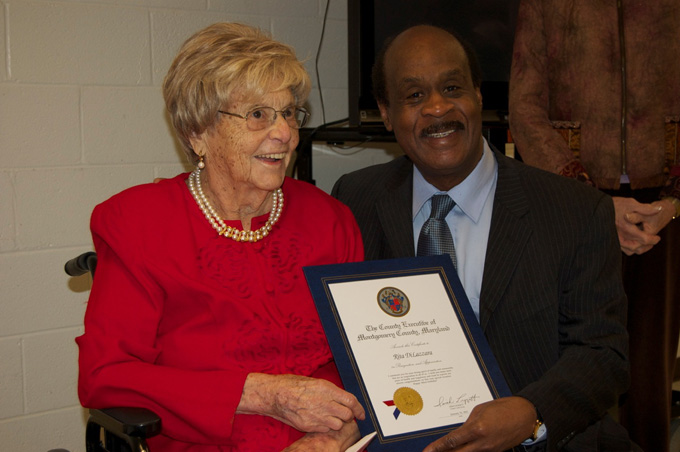Rita DiLazzara receives certificate from County Executive Isiah Leggett